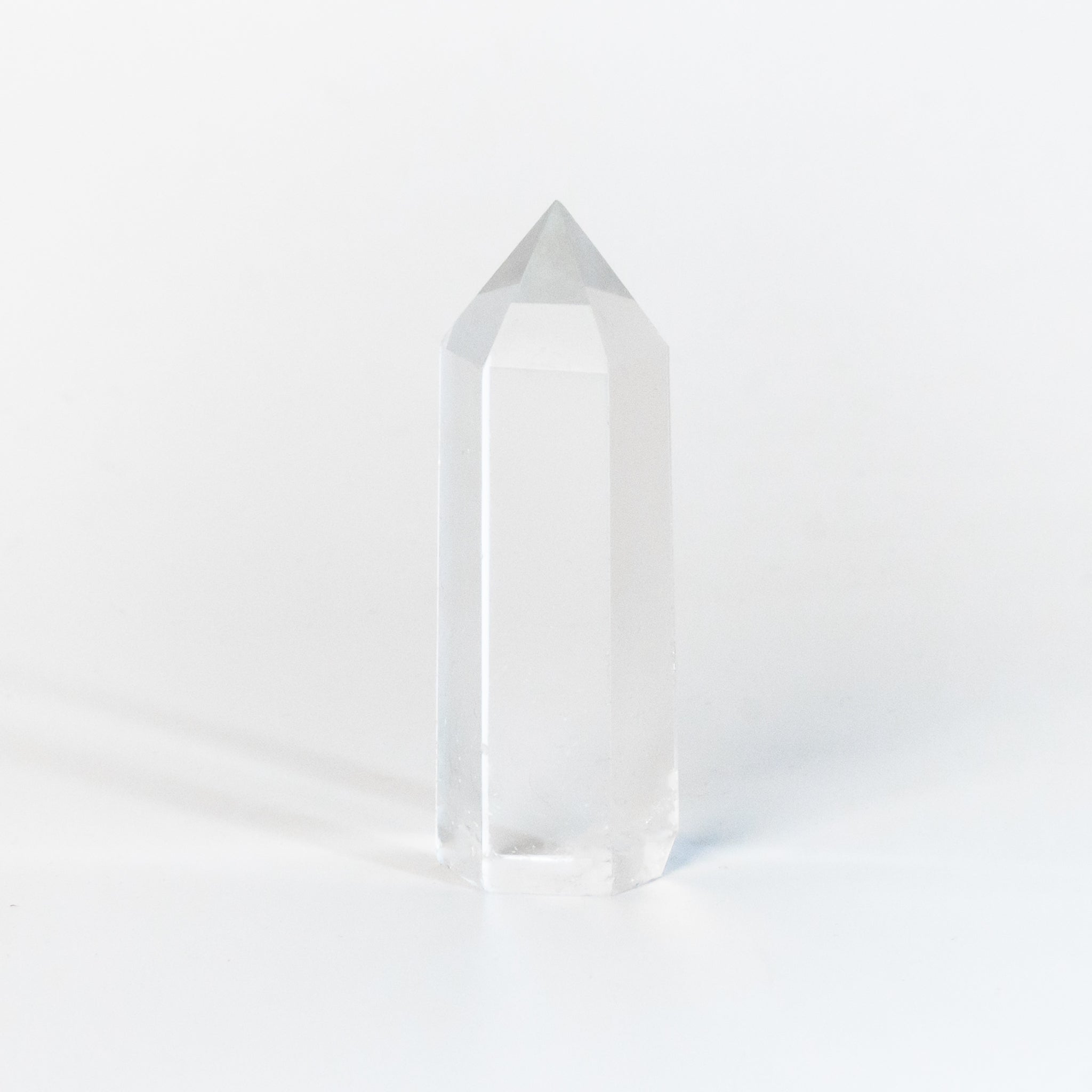 Clear Quartz Obelisk decor item with transparent clarity, enhancing energy in home spaces.