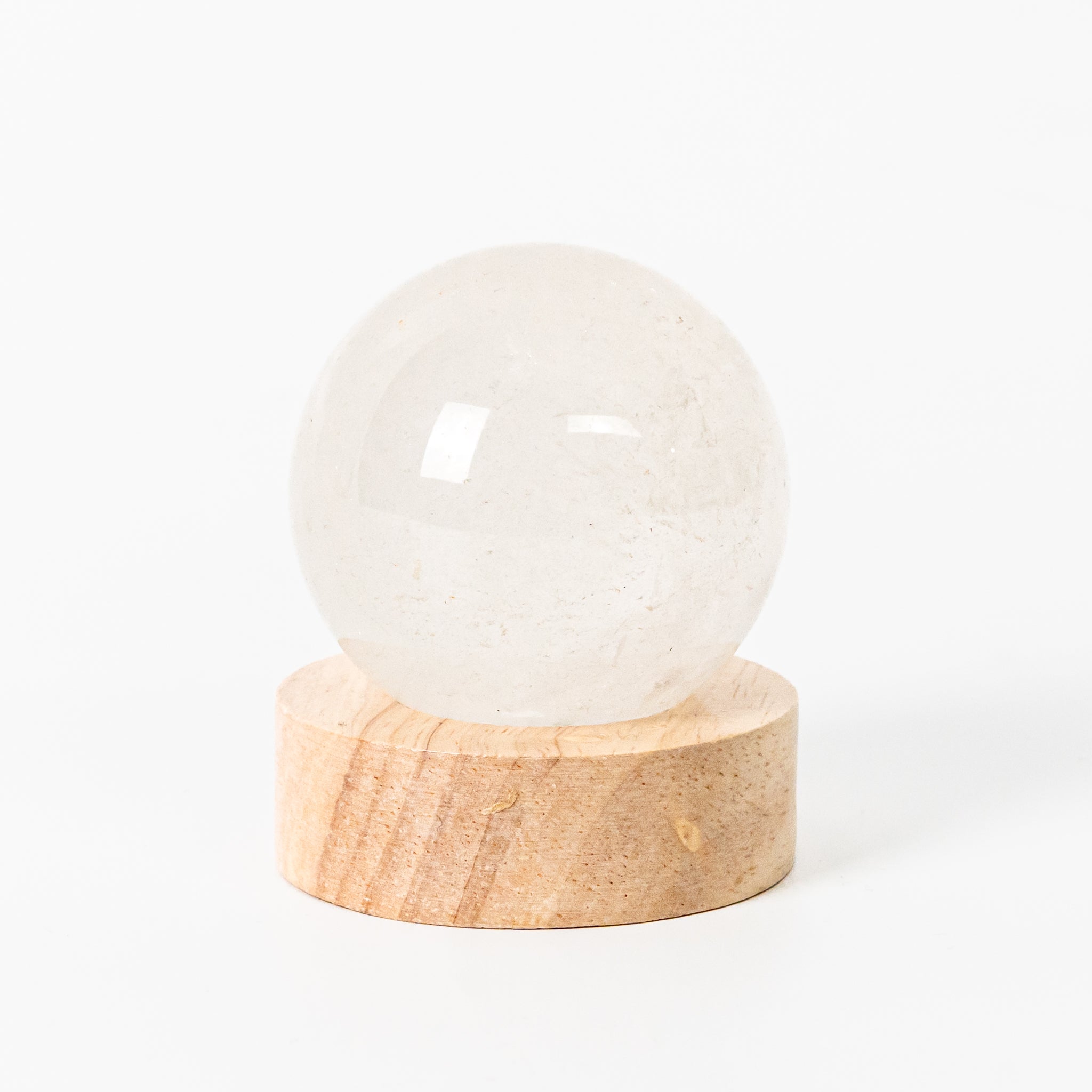Clear Quartz Sphere with LED Base 6cm, featuring transparent clarity to amplify energy in home decor.
