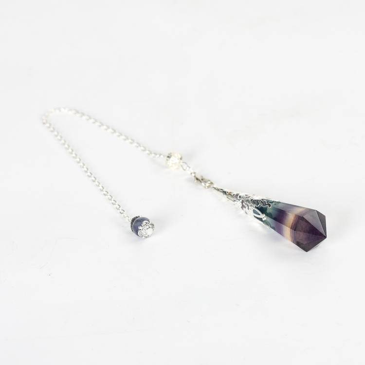 Fluorite Pendulum with vibrant green and purple hues, adding elegance to energy work.