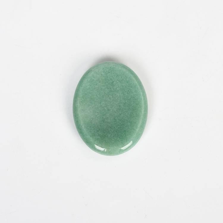 Aventurine Worry Stone with shimmering green hues, promoting growth and stress relief in homes.