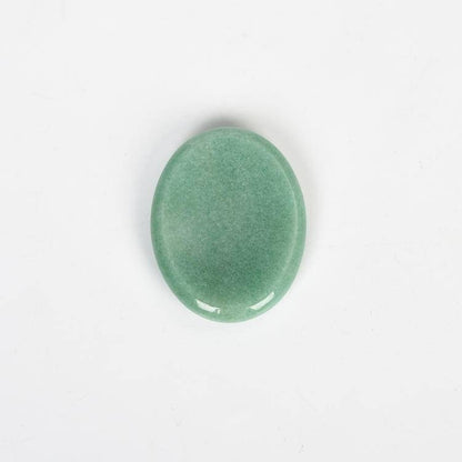Aventurine Worry Stone with shimmering green hues, promoting growth and stress relief in homes.